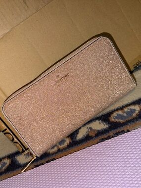 kate spade glitter zip-around wallet in rose gold shimmer